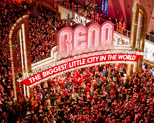 Reno Santa Crawl crowd gathers under Reno Arch