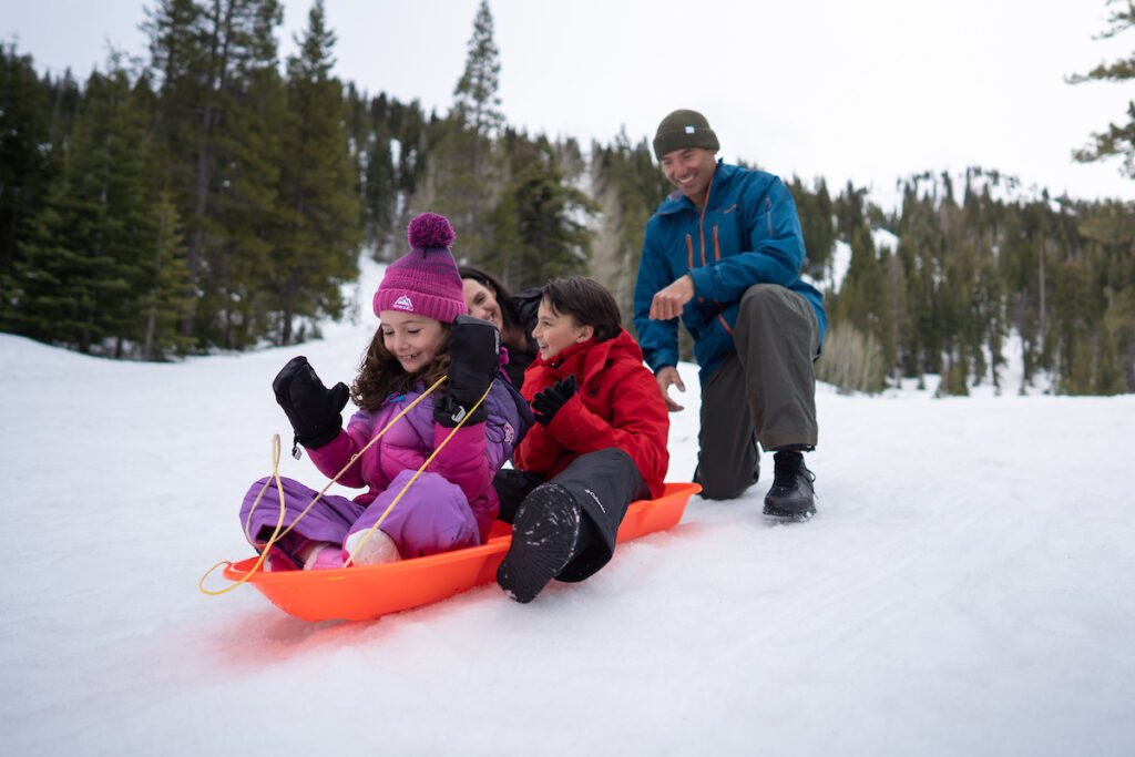 Sledding down hill, snow activities in Lake Tahoe
