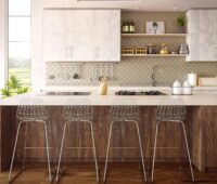 Modern kitchen with four stools at the counter.