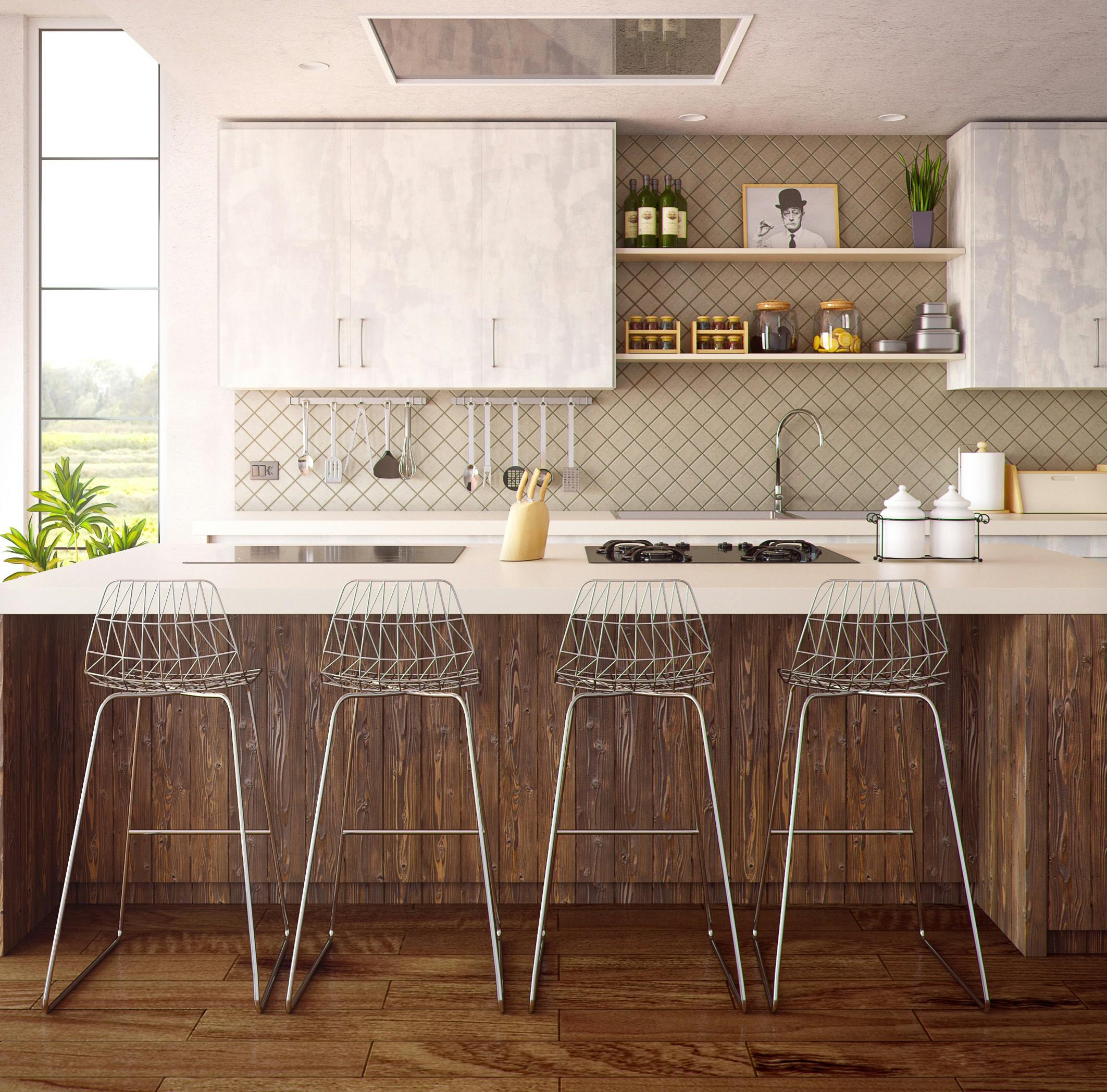 Modern kitchen with four stools at the counter.