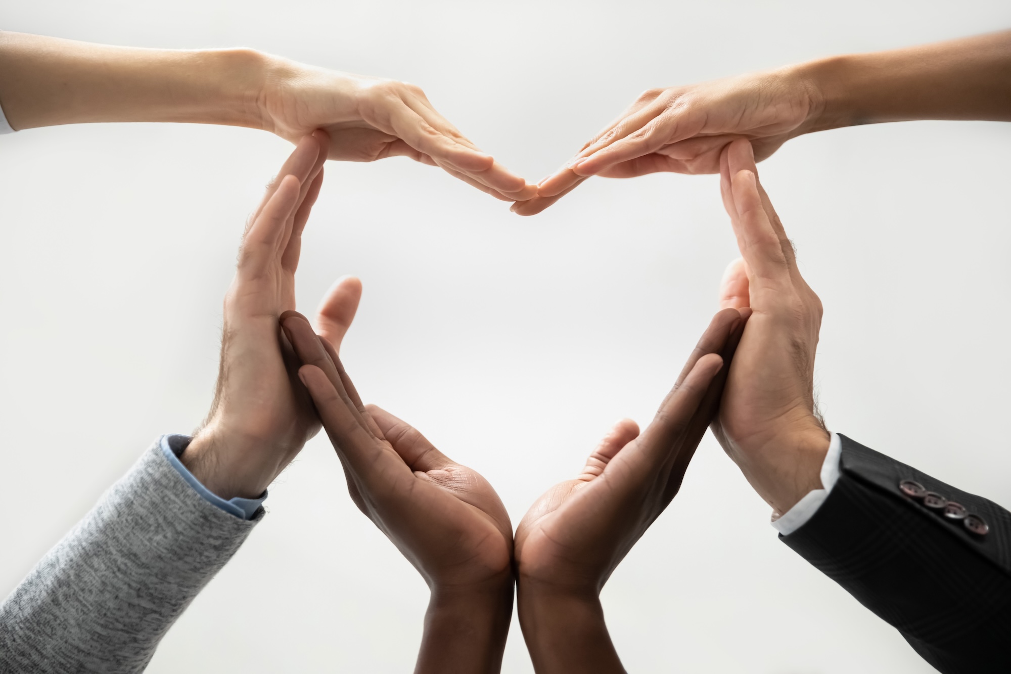 hands forming a heart to symbolize community involvement