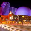 Downtown Reno Nevada hotels at night with traffic trails.