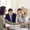 Couple meeting real estate agent to get home buying advice