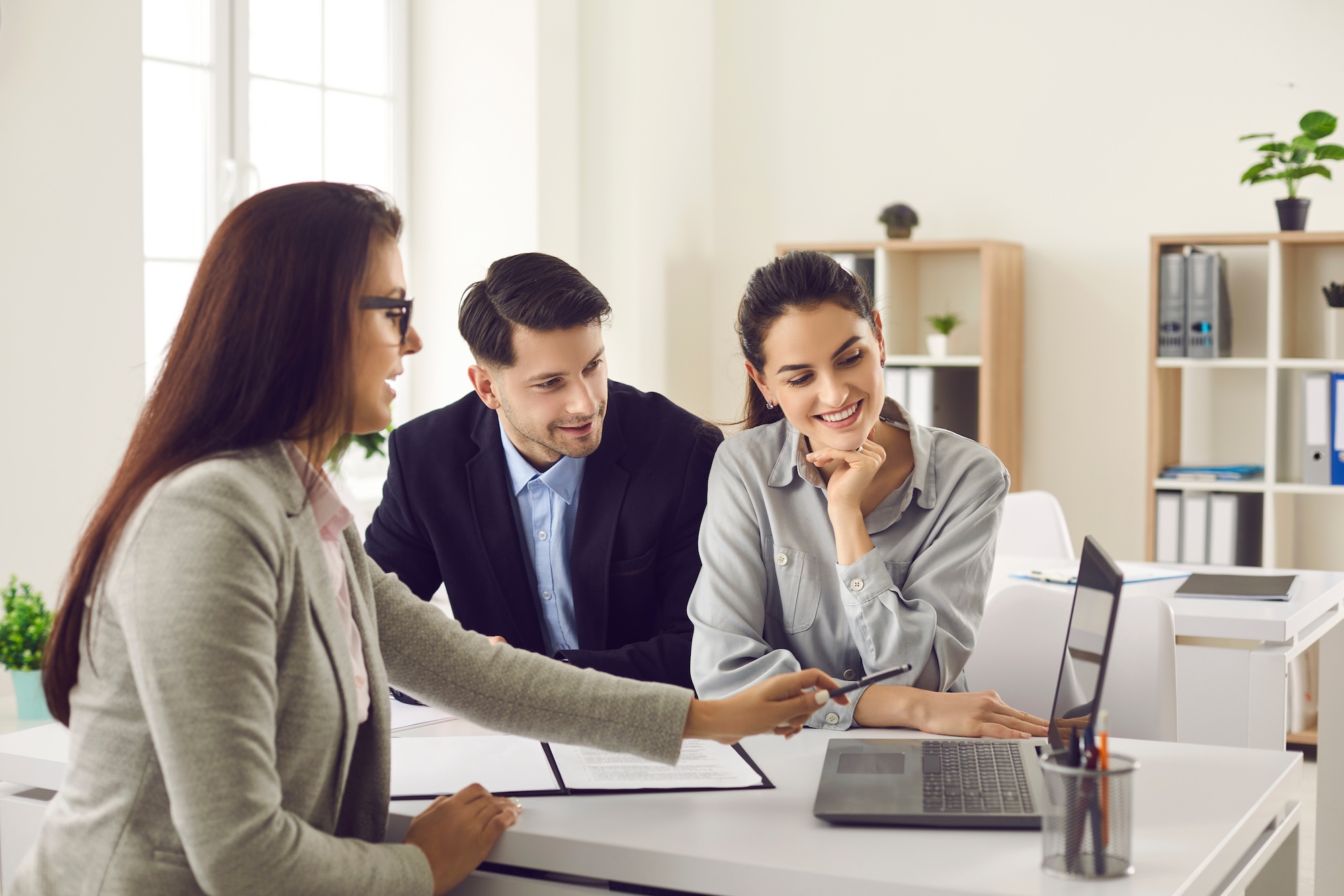 Couple meeting real estate agent to get home buying advice