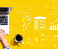 Illustration of a house, bar chart, and checklist on a yellow background with digital symbols and graphs, embodying the essence of real estate technology.